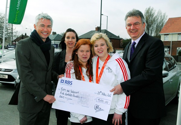 Harrogate Paralympics hopefuls twin sisters Poppy and Serenity Howell receive a sponsorship cheque from Olympic gold Medallist Jonathan Edwards on behalf of Benfield Ford, Harrogate. (Left to right) Jonathan Edwards, Melissa Leach, Teaching Assistant, Poppy and Serenity Howell and Benfield Ford, General Manager, Nigel Clayton