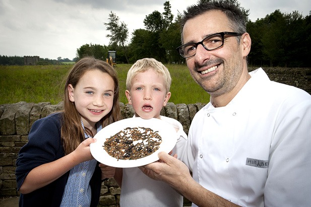 Children from St Peter’s Primary School, Harrogate and Markington Primary School tuck into meal worms with Lionel Strub, chef patron of the Mirabelle restaurant, Harrogate, to mark National Insect Week 2012