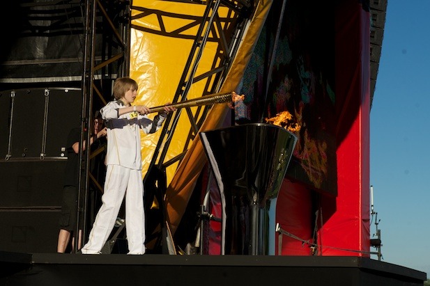 Aaron Bell lighting the cauldron with the Olympic Flame at Temple Newsam