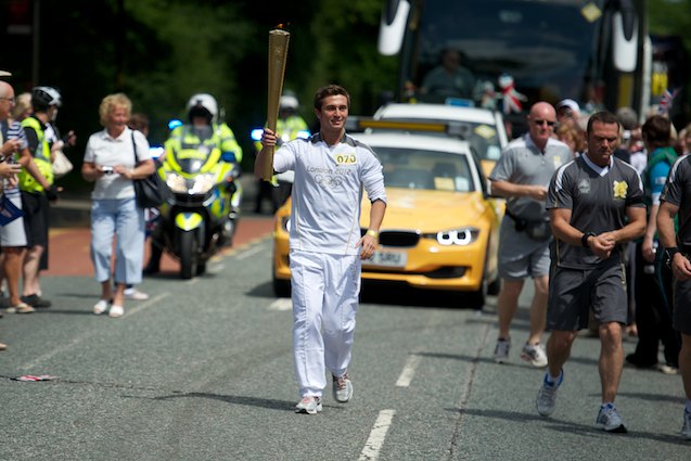 Hasan Musluoglu starts the Harrogate leg of the Olympic torch relay - Knaresborough Road near to the Harrogate Golf Club