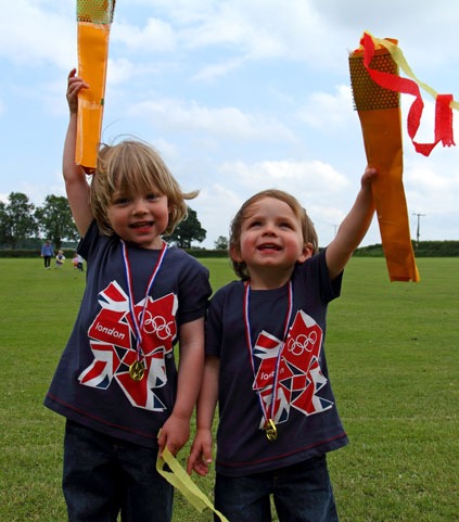 Picture Caption: Oliver Wilson Close (3) and Thomas Wilson Close (2) get warmed up for the Long Marston Playgroup Olympic Torch Run