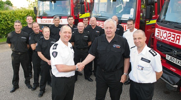 Howard is congratulated by Group Manager Mal Austwick (left) and Station Manager Peter Gregory