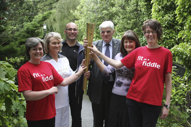 Age UK North Yorkshire staff, trustees and volunteers.  From the right: Alex Bird CEO of Age UK North Yorkshire, Sue Couture, Olympic Torch bearer for Knaresborough, Lee Thomspon, Age UK Fit as A Fiddle Regional Co-ordinator, Councilor Bernard Bateman – Age UK North Yorkshire Trustee, Caroline Johnston, Age UK North Yorkshire Trustee, Sarah Prescott, Ageing Well Co-ordinator, Age UK North Yorkshire.