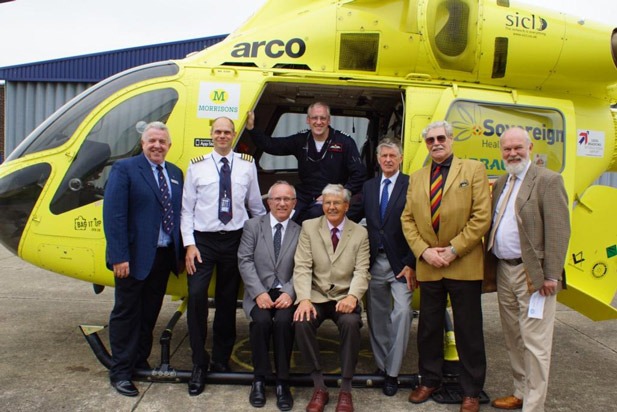 Giving the Yorkshire Air Ambulance A Lift! (from left to right) Vice Chairman of West Riding Masonic Charities Ltd, Roger Newhouse; Chief Pilot Andy Lister, Provincial Grand Charity Steward, N&E Ridings, Stan Thompson; Pilot Steve Waudby, North & East APGM Malcolm Dabbs; Yorkshire West Riding APGM, J Rodney Tolson; Chairman of the N&E Ridings Provincial Grand Charity, John Hemy; Provincial Grand Charity Steward West Riding, Stuart Grantham
