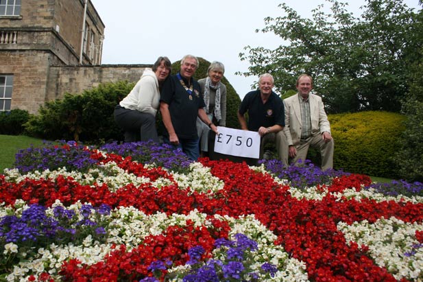 left to right Christine Willoughby Chair of Knaresborough in Bloom, Lion President Phil Oldfield, Knaresborough in Bloom volunteer Penny Carpenter, Lion Martin Berry and Knaresborough in Bloom volunteer Andrew Willoughby