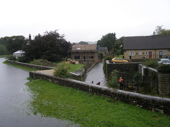 River at Pateley bridge overflowing nearby house - Michael Thompson