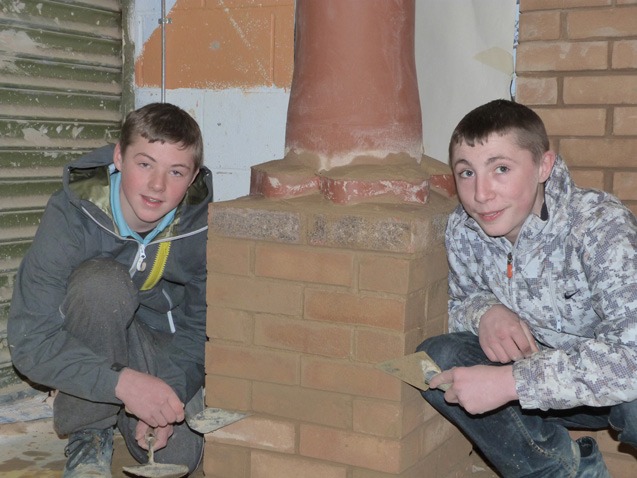 Robbie Nelson and Jack Marshall add the  finishing touches to the Christmas chimney stack