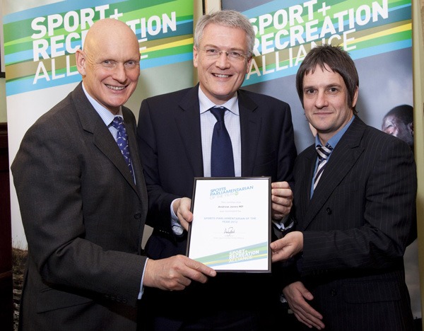Andrew Jones MP holding his award with, on the left, Duncan Goodhew MBE and on the right, David Watson, Executive Director of North Yorkshire Sport