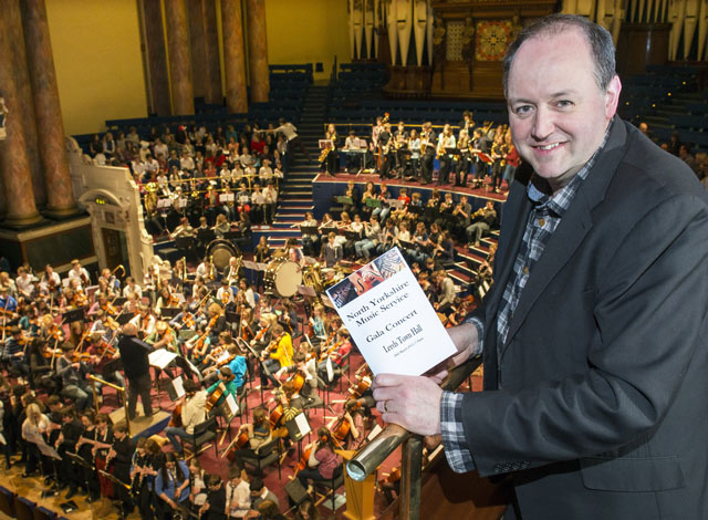 Classic FM’s artistic director Tim Lihoreau with students from North Yorkshire County Council’s Music Service during their Leeds concert