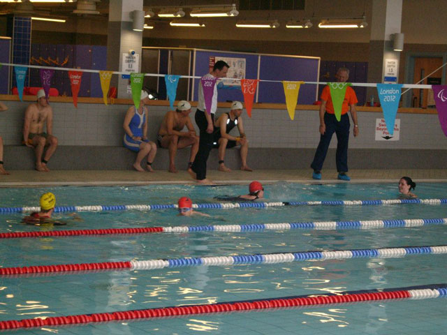 Swimmers Tracey and Michael are the first team members to start, each completing their 16 lengths of the Craven Pool