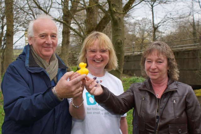 Lucky Ducky! Winning duck owners Andy Bain and wife Anne, from Barwick in Elmet, with Darley Mill Centre race organiser Linda Shreeve
