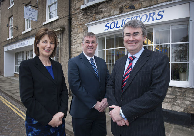 Husband-and-wife legal team, Sarah and Chris Newton, with Nick Hodgson (centre) outside Hodgsons & Mortimer’s office in Richmond Husband-and-wife legal team, Sarah and Chris Newton, with Nick Hodgson (centre) outside Hodgsons & Mortimer’s office in Richmond