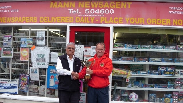 Mr Mann being presented, the West Riding premiere league champions cup by Simon Mercer, Harrogate Railway Ladies coach