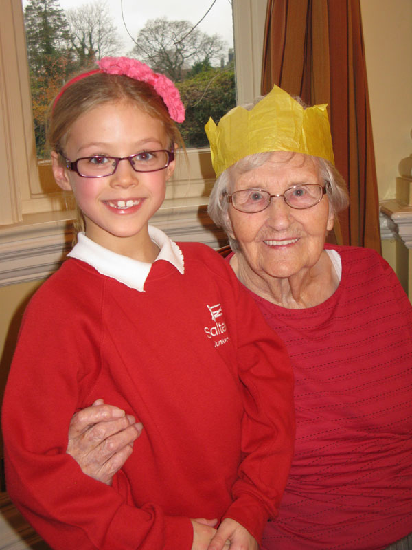 Joining generations: Youngest Saltergate Junior School Choir member, Paige Clark, age 7, enjoys chatting to diner Jane Poulton,100, at the Opening Doors Christmas Lunch