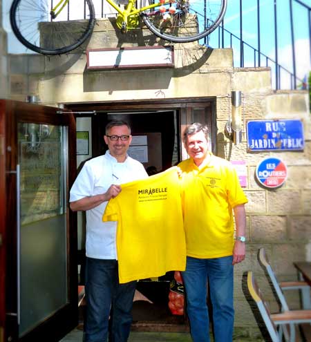 Lionel Strub from Mirabelle presents the yellow jerseys to pétanque player Graham Richards, to raise money for Sain Michael’s Hospice