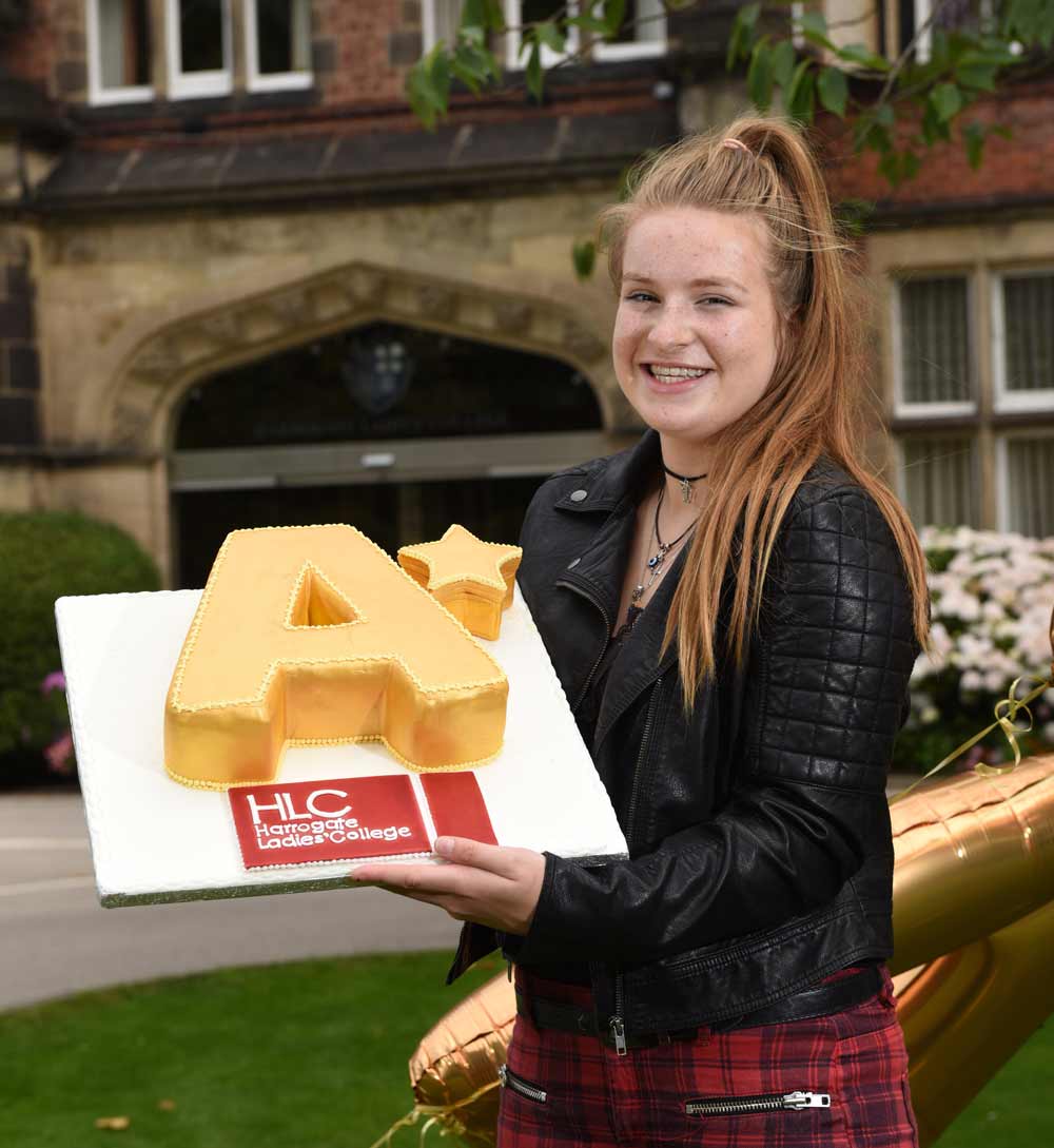 Harrogate Ladies’ College student Frankie Wood, celebrates A* grades with a madeira cake specially prepared by the school’s award winning Catering Team