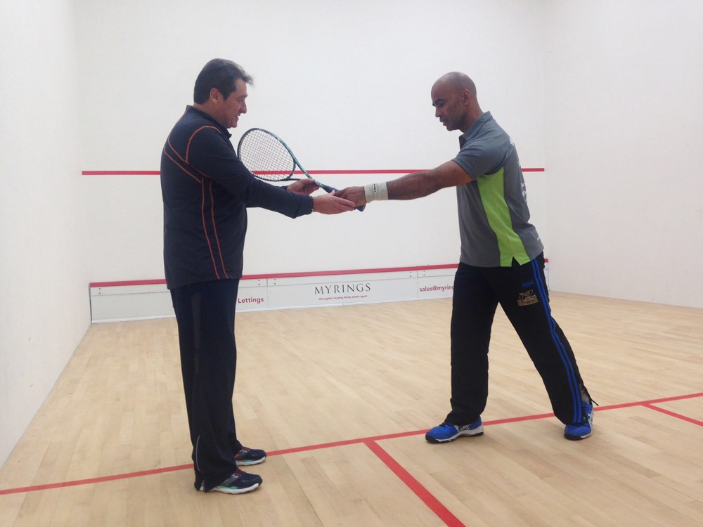Dave Pearson - Coach, Randolph Victor (squash player) receiving coaching advice