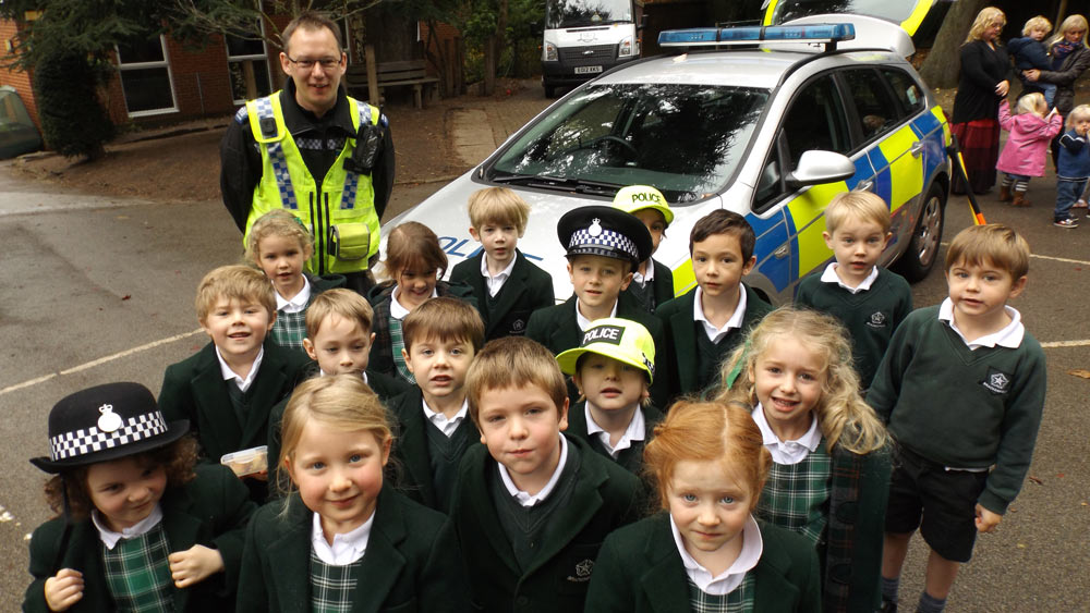 The photograph shows PC Jakes with some of the Brackenfield Pupils