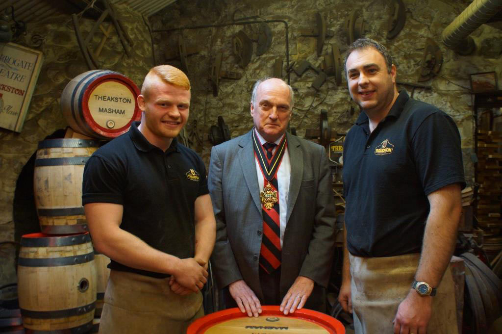 Theakston’s apprentice craft brewery cooper Euan Findlay (left) with   Vivian Bairstow, Master of the Worshipful Company of Coopers and Jonathan Manby, Theakston’s craft brewery cooper
