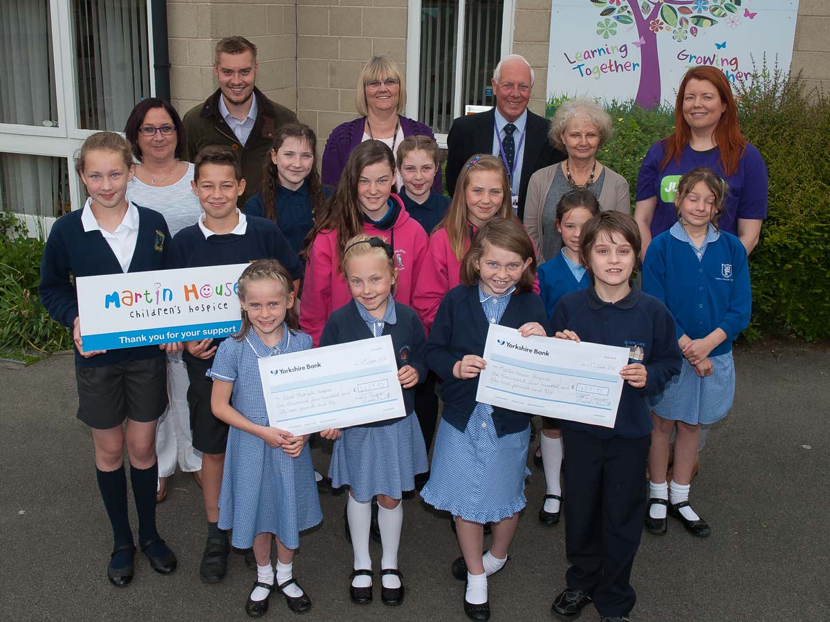 Cheques were presented at Killinghall CE Primary to Martin House and Just 'B'
