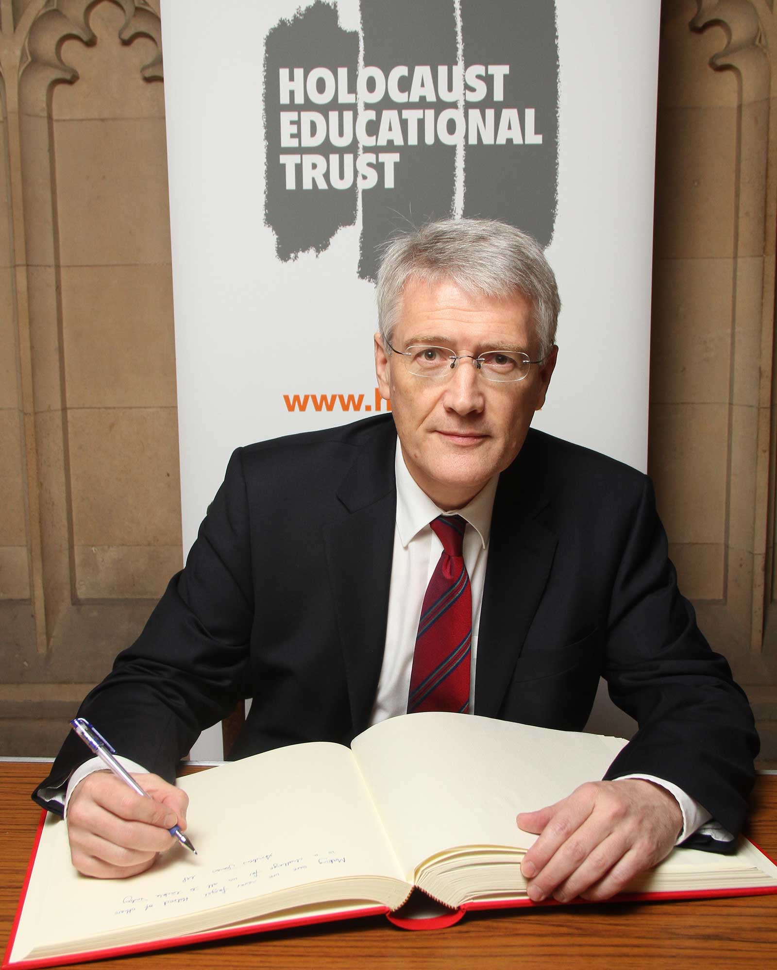 Andrew Jones signing the Holocaust Educational Trust’s Book of Commitment
