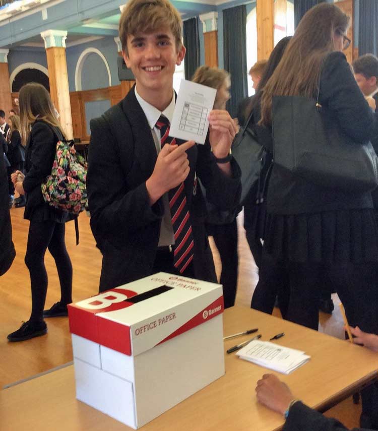A student casts their vote