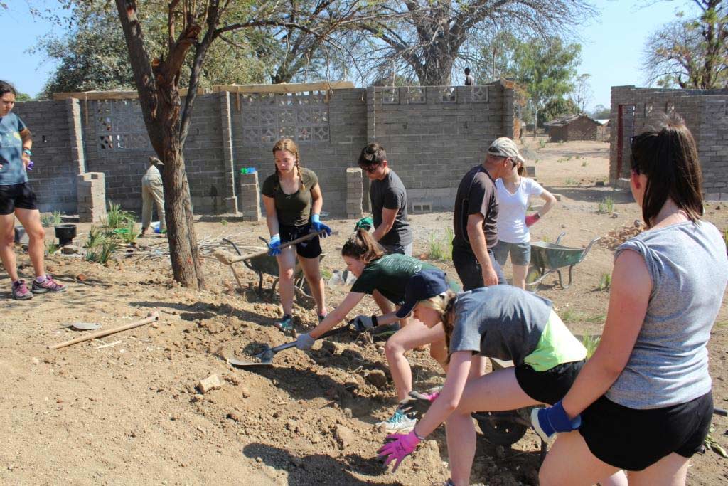The students were digging to help build an eco-toilet
