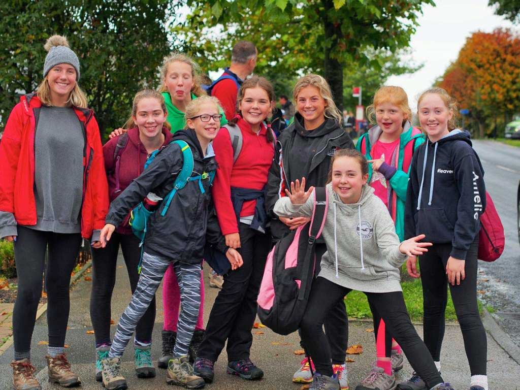 Smiles Along The Miles! Smiling pupils head for the finishing line