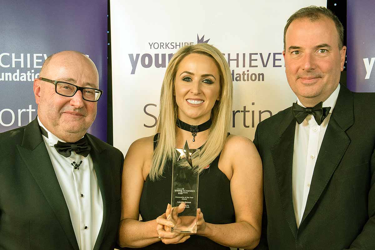 Personality of the Year Lizzie Jones receives her award from Awards Chairman Peter McCormick and Peter Banks, Managing Director of sponsors Rudding Park