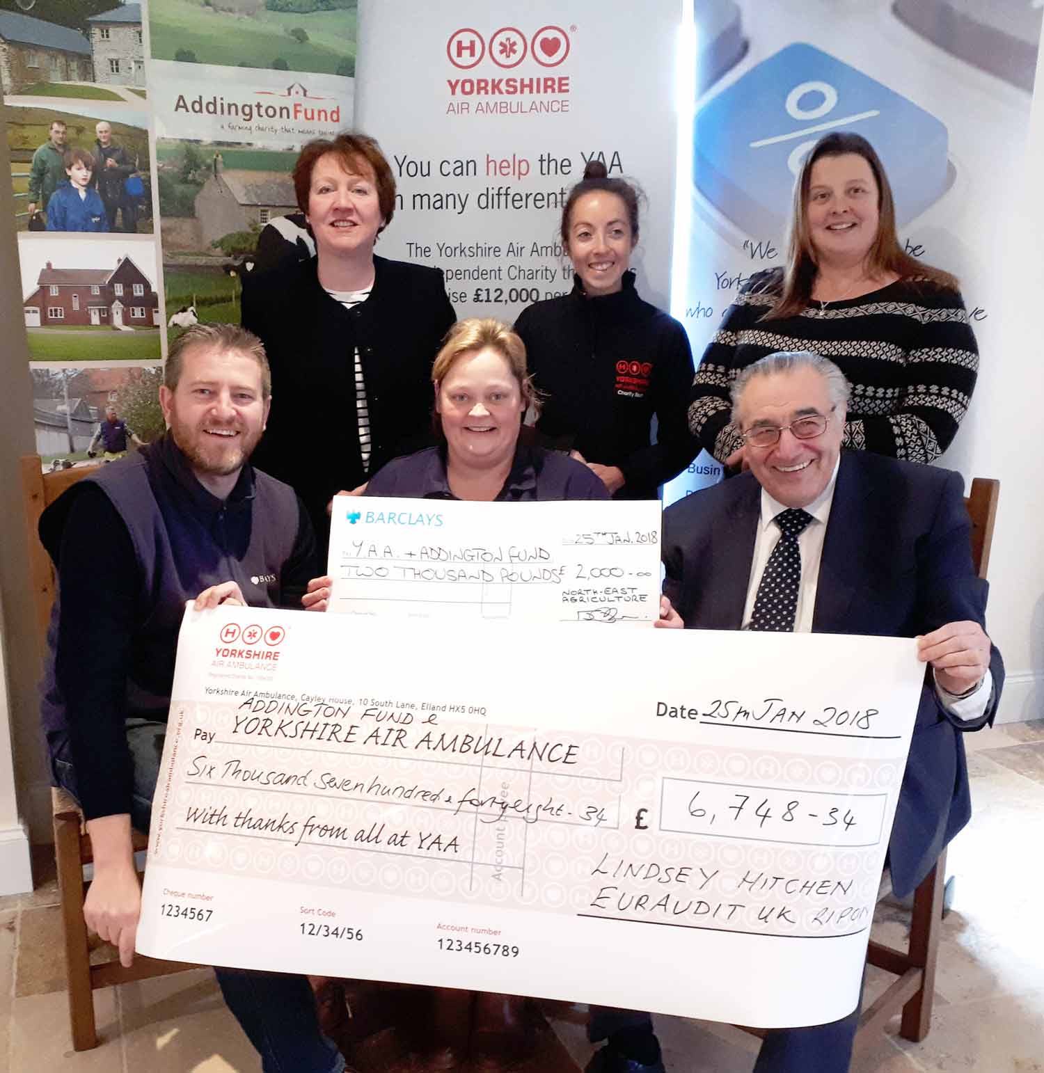 Pictured at the 2018 Yorkshire Farmhouse Big Breakfast cheque presentation – the final proceeds were considerably higher - are, back row from left, Christine Ryder, of Scaife Hall Farm B&B, Blubberhouses, also a trustee of the Addington Fund, Olivia Mulligan, the Yorkshire Air Ambulance’s North Yorkshire Community Fundraiser, and Farm Stay UK member Tanya Umpleby, of Spruisty Hall Farm, Killinghall. Seated, from left, are Ian Robson, Barclays’ regional agricultural manager, Big Breakfast host Lindsey Kitchen, and Eura Adit’s Brian Elsworth