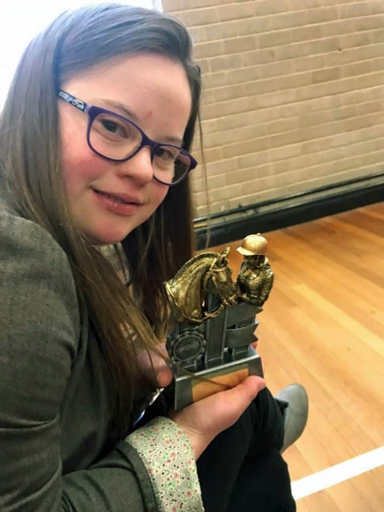 Megan with with Equestrian of the Year award from able 2 Pontefract Special Olympic Group