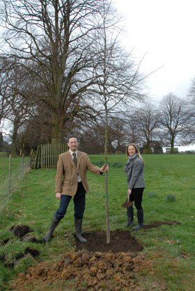 Mark and Clare Oglesby planting a tree in the Lime Tree Walk