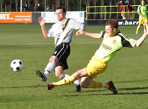 Paul Brayson beats his man