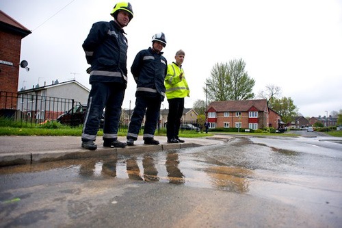 Water rising through the road