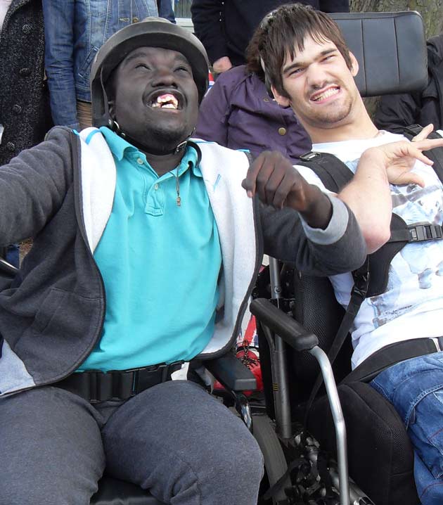 Nathan & Anthony from Henshaws College soak up the atmosphere as the Olympic torch continues on its journey towards Harrogate