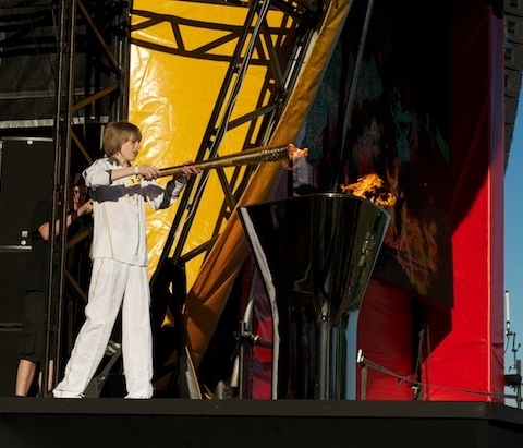 Aaron Bell lighting the cauldron with the Olympic Flame at Temple Newsam