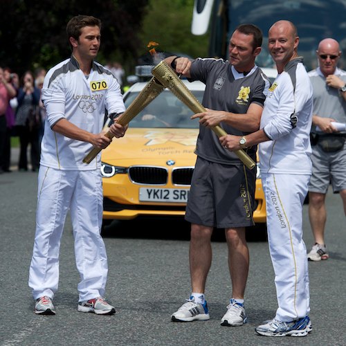 Hasan Musluoglu hands the flame over to Andrew Mcmenemy