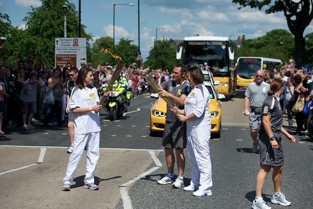 Megan Smith gives the flame to Helen Mackenzie