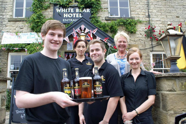 Ale Hands To The Pumps! White Bear Hotel General Manager Sue Thomas (second from right) with, from left Josh Waterton-Bailey, Sarah Pentith, John Goodyear and Sally Buckle, who are putting the finishing touches to the 11th Annual White Bear Hotel Beer Festival