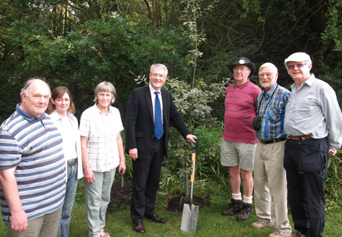 Andrew Jones MP (centre) and the newly planted Jubilee tree with members of the Pinewoods Conservation Group