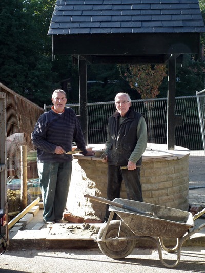 Knaresborough Rotarians Dennis Houseman (left) and Clive Rodda putting the finishing touches to the Wishing Well on Waterside