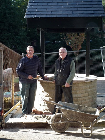 Knaresborough Rotarians Dennis Houseman (left) and Clive Rodda putting the finishing touches to the Wishing Well on Waterside Knaresborough Rotarians Dennis Houseman (left) and Clive Rodda putting the finishing touches to the Wishing Well on Waterside
