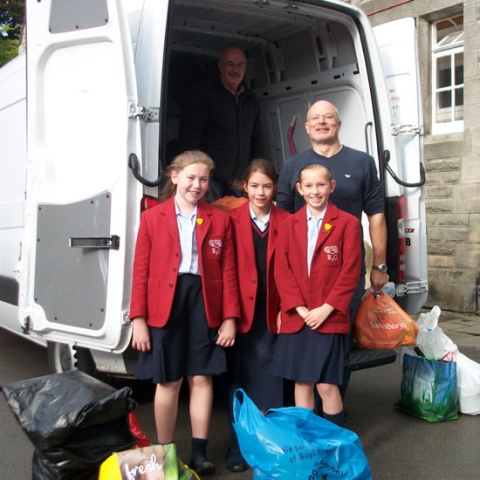 Rebecca Troy (Deputy Head Girl), Sophie Jones (Charities' Prefect) and Alexia Broadbent (Head Girl) with Tony Frazer and Brian Anderson (in the van)
