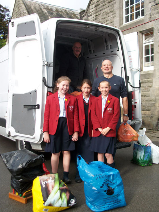 Rebecca Troy (Deputy Head Girl), Sophie Jones (Charities' Prefect) and Alexia Broadbent (Head Girl) with Tony Frazer and Brian Anderson (in the van)
