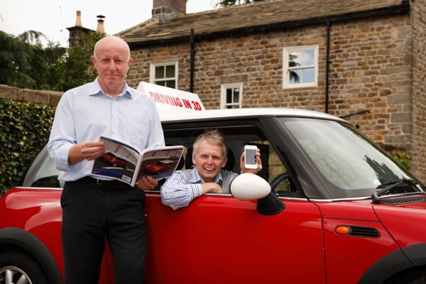 On The Road To Safer Driving! Harrogate driving instructor Phil Hirst, stood outside car, and colleague Richard Rawden have created a revolutionary App aimed at learner drivers