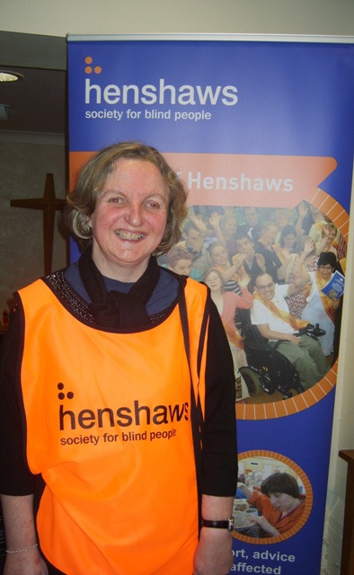 Debs, Henshaws-service-user, welcomes visitors on the door Debs, Henshaws-service-user, welcomes visitors on the door
