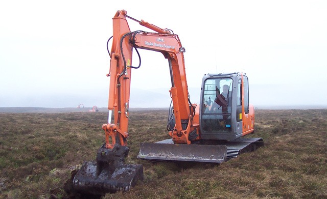 The team blocking a grip (channel) on Gletsdale Reserve in Cumbria