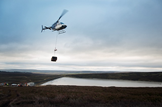 A helicopter helping with work to restore peatland on another project