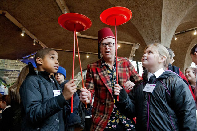 Students from Collingwood Primary School, Hull try plate spinning with Pete White and his suitcase circus Students from Collingwood Primary School, Hull try plate spinning with Pete White and his suitcase circus