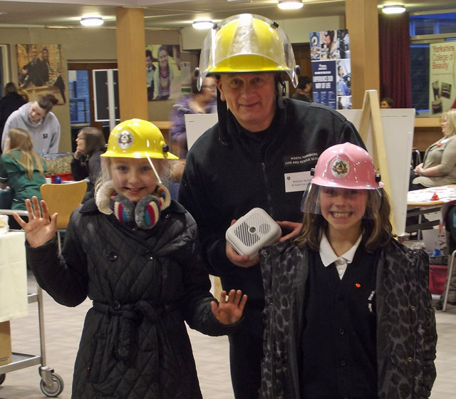  North Yorkshire Fire Service’s Malcolm Dunford talks to 10-year-old Taylor Leworthy and Daniella Pilkington from Starbeck School about a career in the fire service